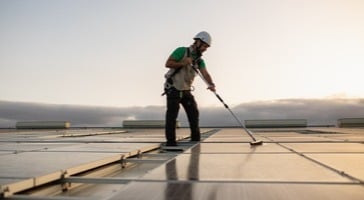 Cleaning solar panels on roof