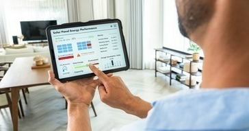 Man reviewing solar production data