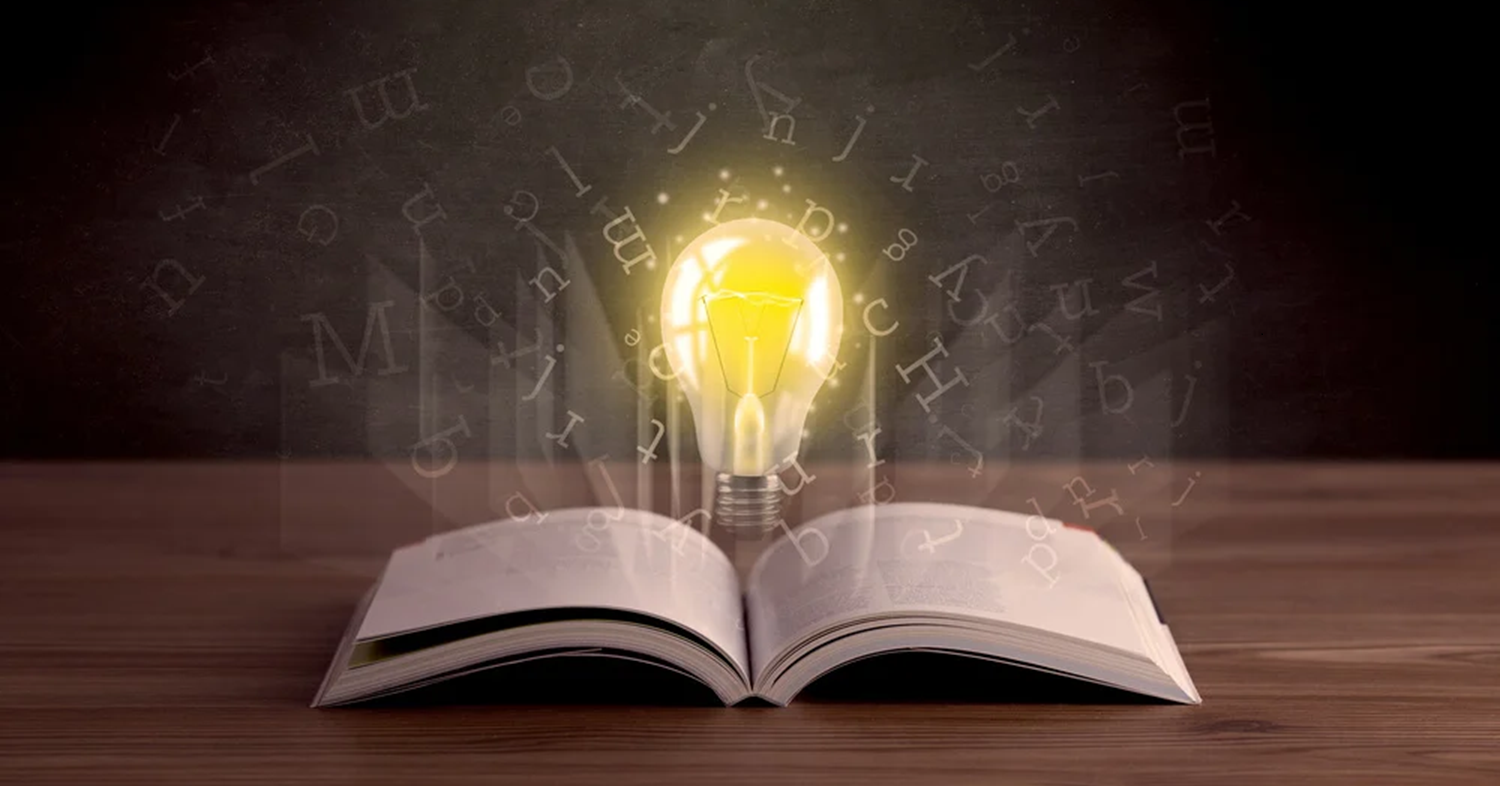 solar glossary - book with lightbulb and letters coming out of it